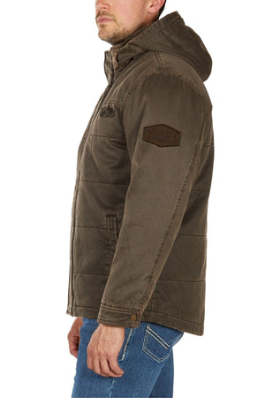 A man in side profile wears the Bullzye Canon Jacket, a brown hooded jacket with a sleeve patch, paired with blue jeans against a white background.