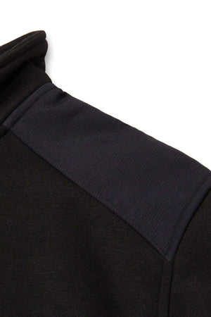 Close-up of the CAT Essential 1/4 Zip Sweatshirt's shoulder. The fabric looks soft, featuring a lighter black patch from shoulder seam to sleeve, reminiscent of warm fleece lining, offering a subtle texture and shade contrast.