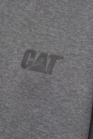 A close-up photo of a gray fabric with the "CAT" logo printed in black on it. The texture of the CAT Essential 1/4 Zip Sweatshirt is visible, showcasing the super soft fleece lining. The logo features the stylized letters "C," "A," and "T," with the letter "A" forming a triangular shape.