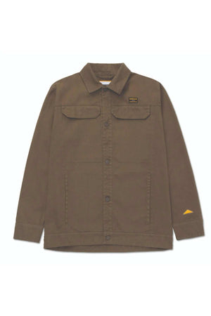 CAT Heritage Uniform Twill Shirt Jacket—brown cotton twill with collar, long sleeves, flap chest pockets, left chest rectangular patch, and yellow triangular patch on lower right sleeve; perfect as an outdoor work jacket.