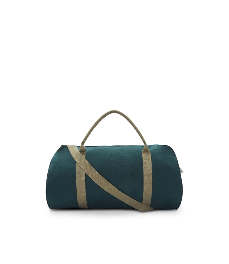 The RM Williams Nanga Canvas Bag in dark green features a versatile duffle design with beige handles, an adjustable beige shoulder strap, and is made from durable cotton canvas, shown against a plain white background.