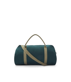 The RM Williams Nanga Canvas Bag in dark green features a versatile duffle design with beige handles, an adjustable beige shoulder strap, and is made from durable cotton canvas, shown against a plain white background.
