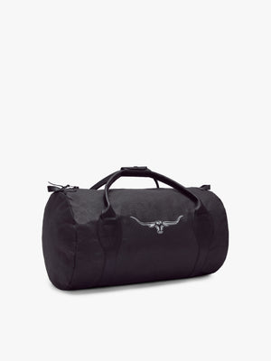 The RM Williams Canvas Ute Bag is a black duffel with water resistant fabric, leather handles, side zipper, and a white bull head logo on the front. It is displayed on a plain white background.