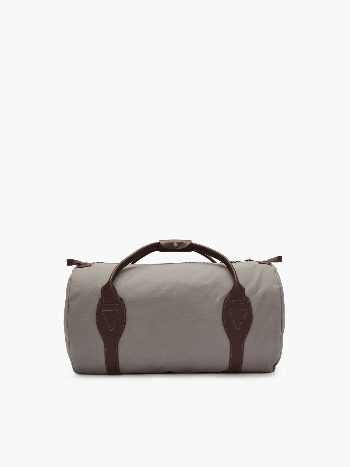 The RM Williams Canvas Ute Bag, a cylindrical gray utility canvas bag, is displayed on a white background. It features brown leather handles and trim, water-resistant material, a top zipper closure, and two matching brown straps at each end.