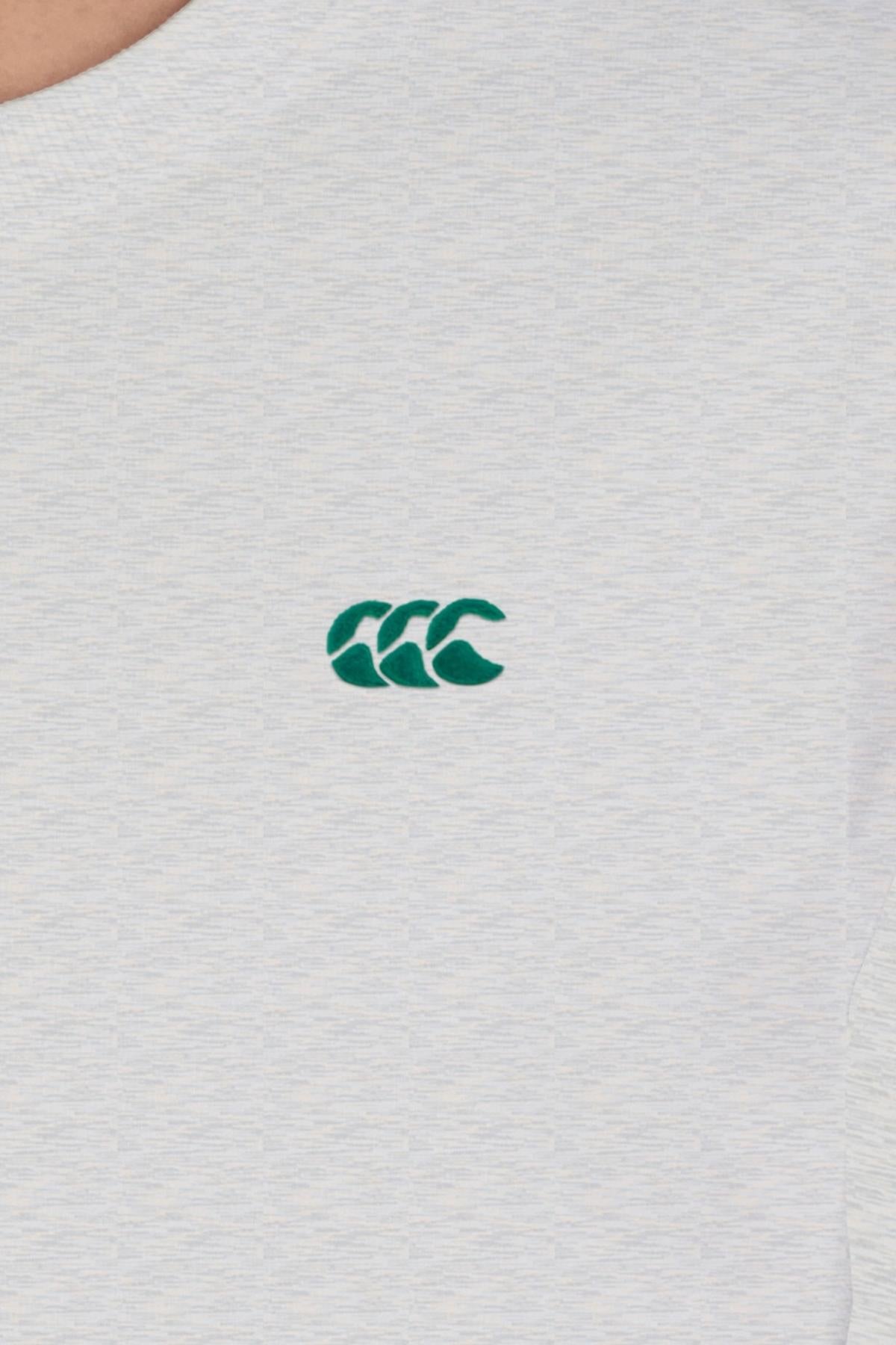 A close-up of the Canterbury CCC Collection T-Shirt in light grey, showcasing a small green embroidered triple "C" logo on the chest and an oversized fit for extra comfort.