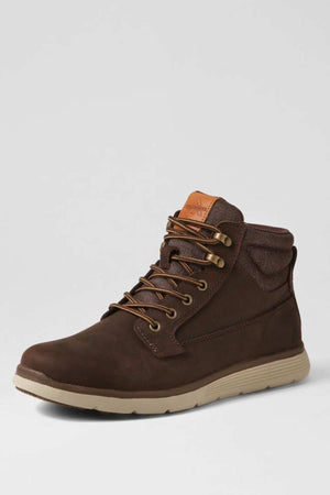 A single brown Colorado Yrbud Boot, featuring a padded collar, tan outsole, shock-absorbing midsole, and tan logo patch on the tongue, is displayed facing left against a light gray background.