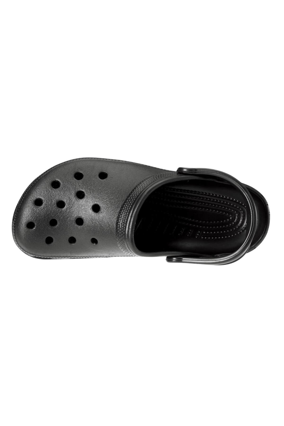 A black Crocs Classic Clog made from rubber, featuring multiple ventilation holes on the top and a movable heel strap, is shown from an overhead view. Ideal for any water adventure, this lightweight shoe includes a textured insole for enhanced comfort.