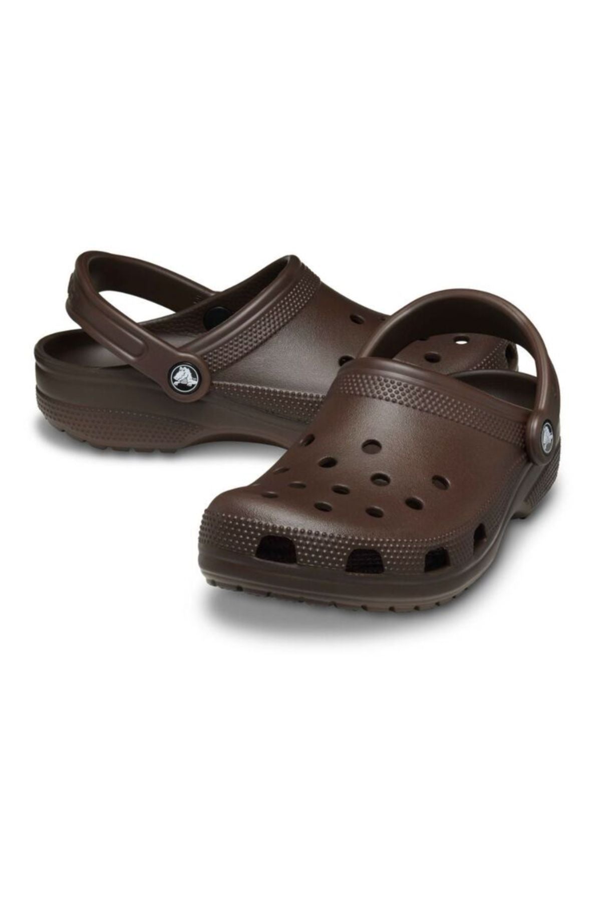 A pair of brown Crocs Classic Clog with ventilation holes and adjustable heel straps is shown on a white backgroundβlightweight, breathable footwear ideal for water adventures.
