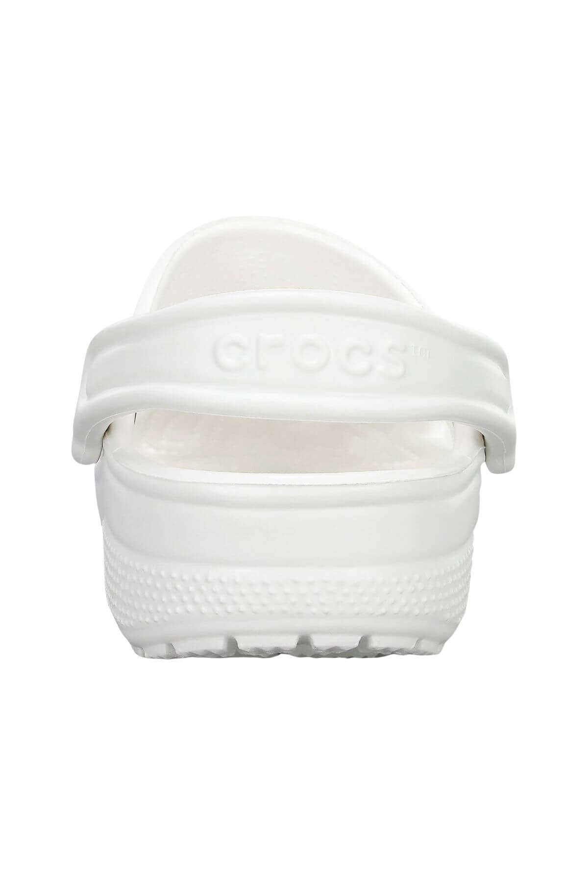 Back view of a single Crocs Classic Clog in white, showcased with an embossed "Crocs" logo on its heel strap and a textured outsole. Lightweight and breathable, it's your ideal companion for a water adventure.