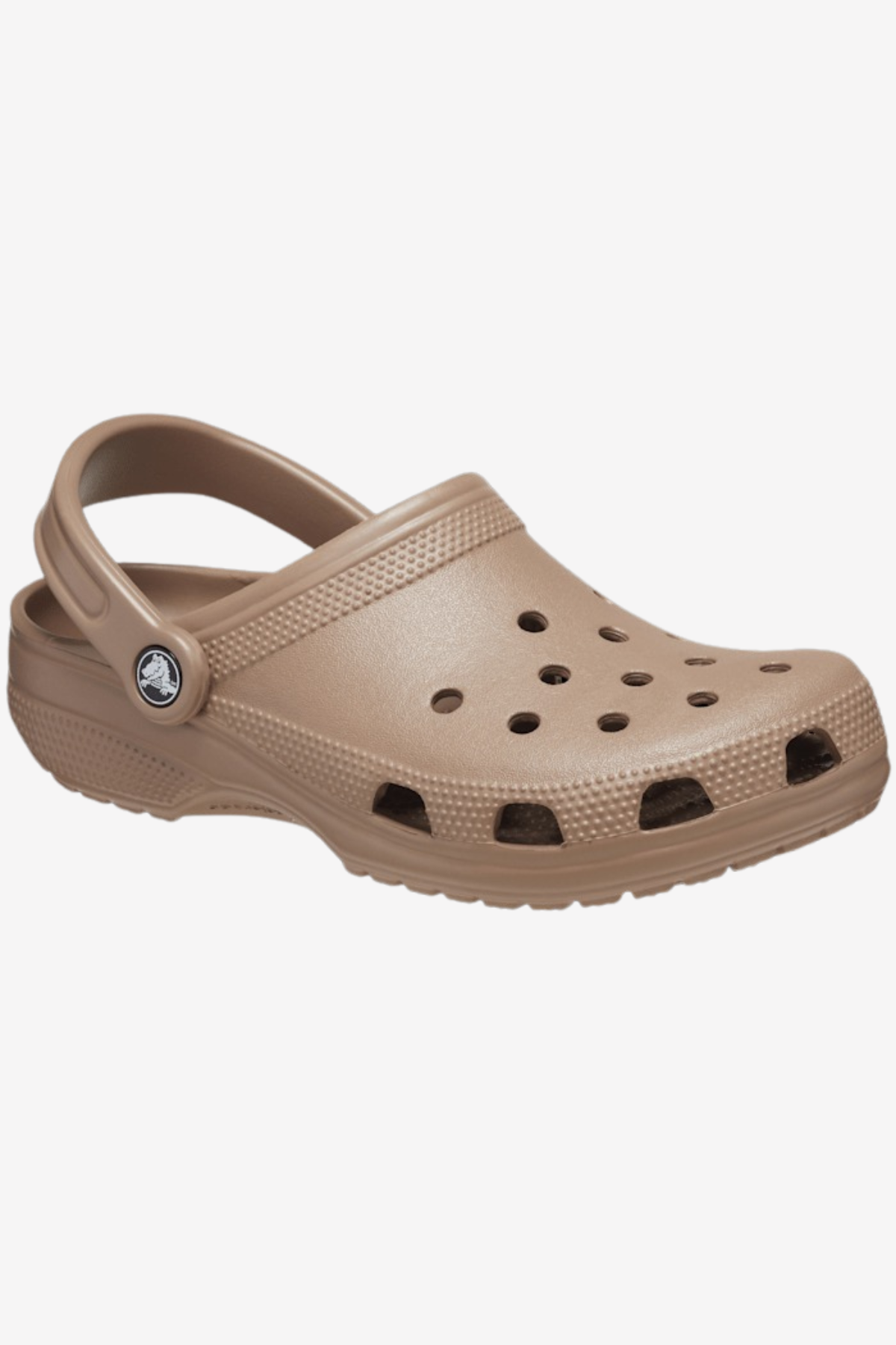 A beige Crocs Classic Clog is shown against a plain white background, featuring ventilation ports for optimal airflow, an adjustable heel strap, and a textured outsole for grip—perfect for your next water adventure.