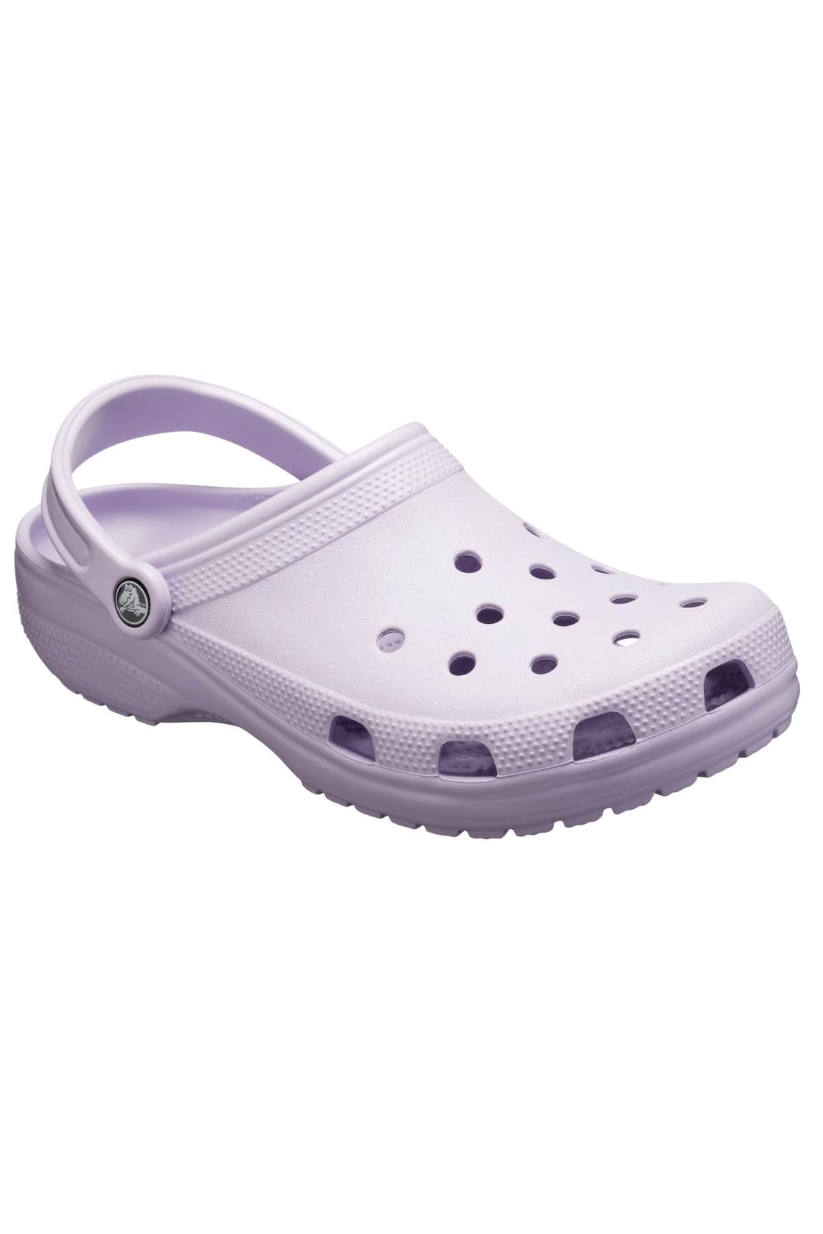 The Crocs Classic Kids Clog, available in light purple, offers signature Crocs Comfort™ and is crafted from Croslite™ material, featuring ventilation holes on the top and sides along with a handy heel strap.