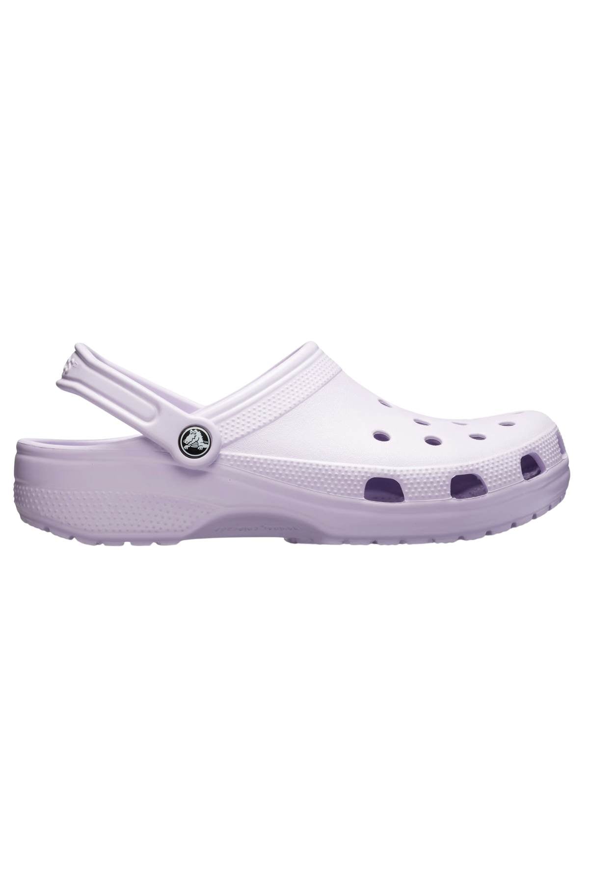 The product image displays a light purple Crocs Classic Kids Clog in profile. Constructed with Croslite™ material, it includes ventilation holes on the upper and a heel strap for signature Crocs Comfort™. Additionally, the textured sole of the shoe is visible.