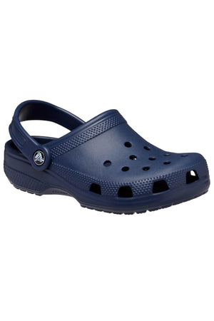 The Crocs Classic Kids Clog, shown as a single dark blue shoe, is made from Croslite™ material providing iconic Crocs Comfort™, with ventilation holes and a heel strap, displayed on a plain white background.