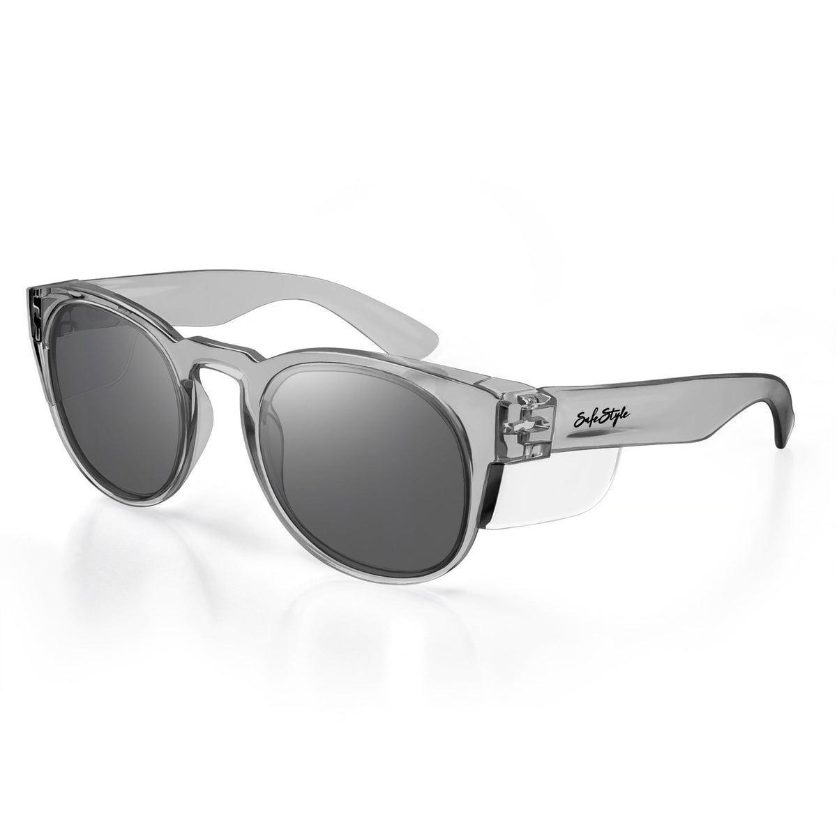 Shown against a plain white background, the SafeStyle Cruisers Graphite Frame Tinted Lens sunglasses feature clear frames with dark lenses. They offer UV400 protection and exhibit sleek, wide arms adorned with the brand's signature logo in black, ensuring both style and safety.