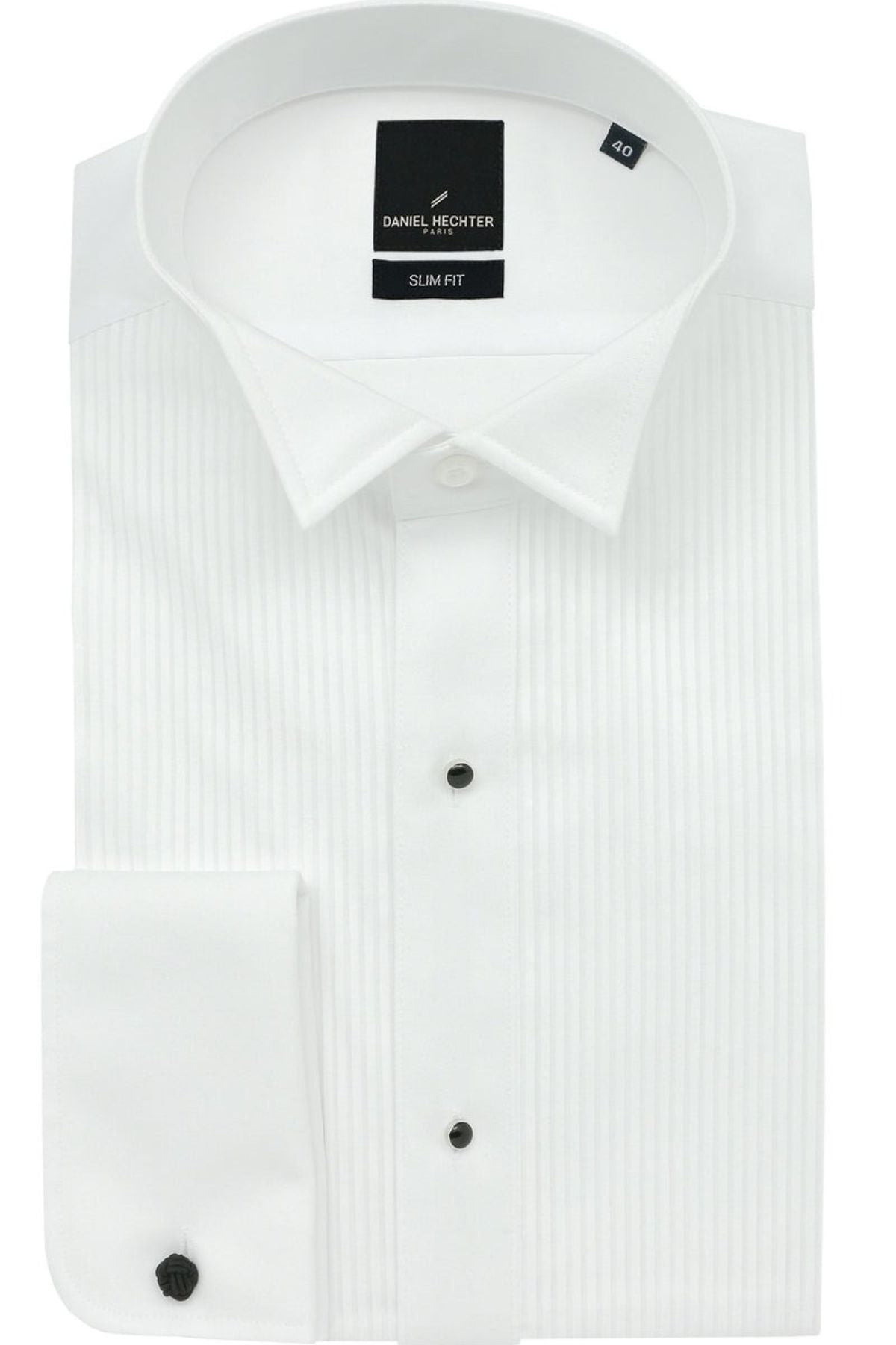 A neatly folded Daniel Hechter Wing Stud Dinner Shirt in crisp white showcases a subtle vertical stripe pattern. Featuring black buttons and a pointed collar, it's perfect for formal occasions. The label inside reads "Daniel Hechter, Slim Fit.