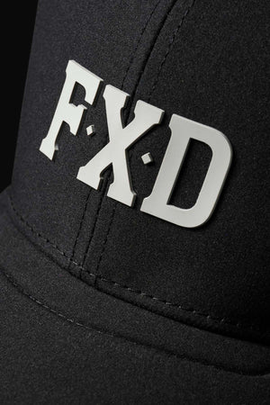 Close-up of the FXD CP-12 Tech Baseball Cap with bold white "F·X·D" letters on the front. Its black backdrop highlights visible stitching, while its lightweight and quick-drying performance polyester ensures comfort.