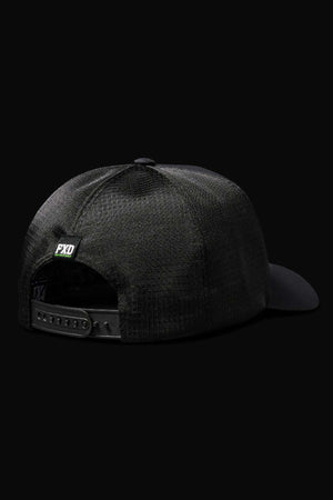 The FXD CP-13 Trucker Cap is displayed from the back on a black background, highlighting its breathable mesh design, adjustable snap-back strap with snap closure, and a small green and white "FXD" label above the opening.