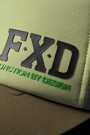 Close-up of the FXD CP-13 Trucker Cap in green and olive, featuring raised black "FXD" letters and bright green "FUNCTION BY DESIGN," crafted from breathable material for comfort.