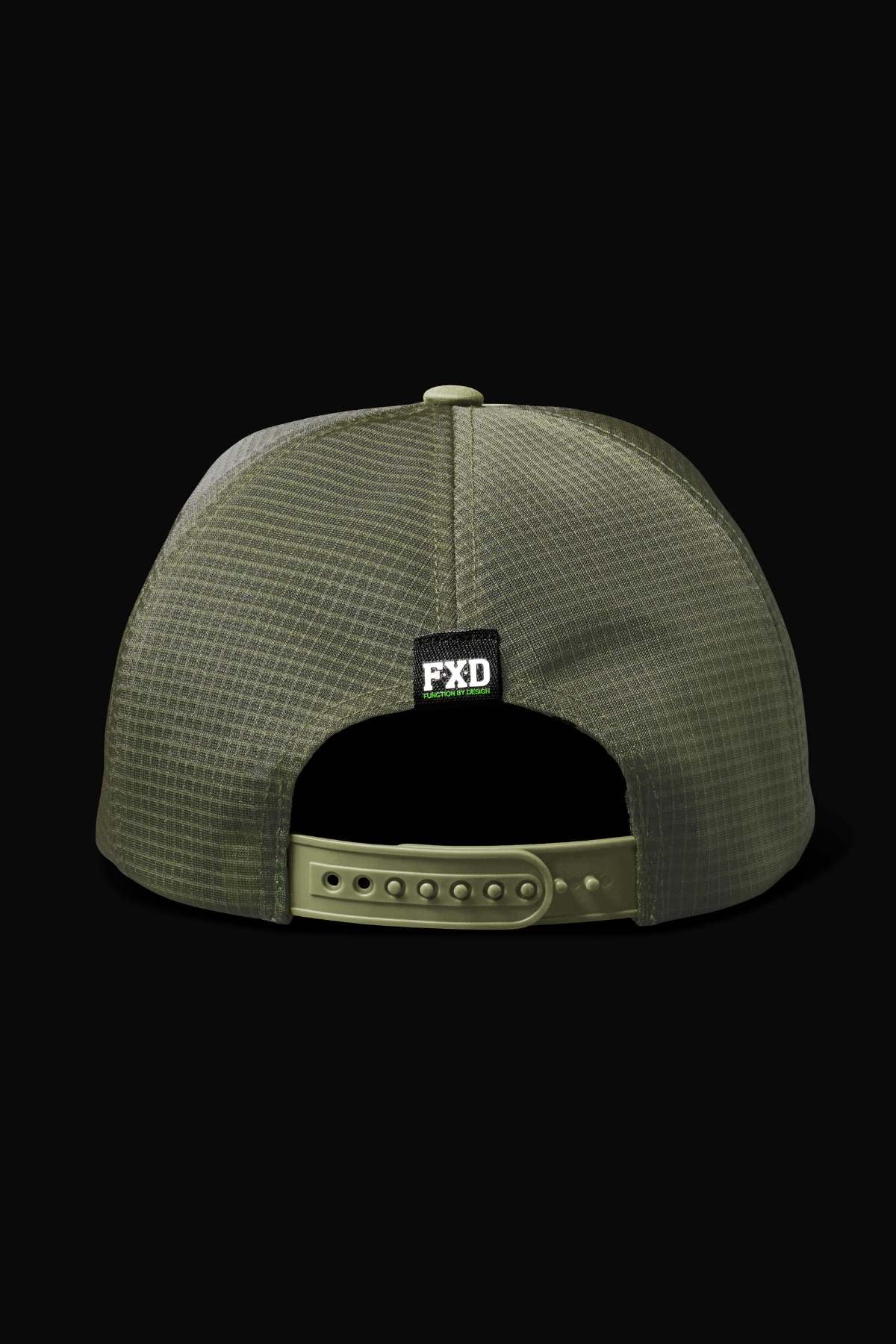 The FXD CP-13 Trucker Cap in olive green mesh is shown from the back, with a snap-back closure and a black FXD logo tag above the opening. Its breathable design stands out against the solid black background.