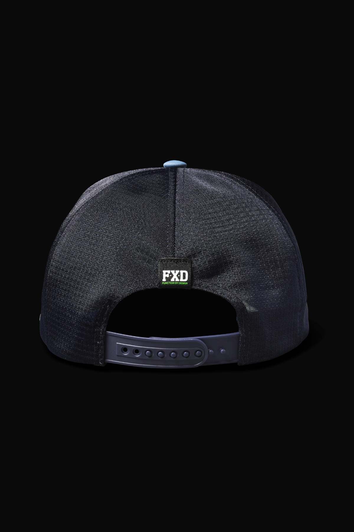 The FXD CP-13 Trucker Cap, seen from the back against a dark background, boasts a snapback closure, breathable fabric, small "FXD" square logo above the opening on the back panel, and a moisture-wicking sweatband for comfort.