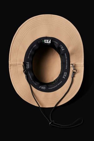 The tan FXD CP-14 Boonie Hat features a black inner band with "FXD" branding, provides sun protection, and includes an adjustable black chin cord. It's quick-drying for convenience and shown top view on a sleek black background.
