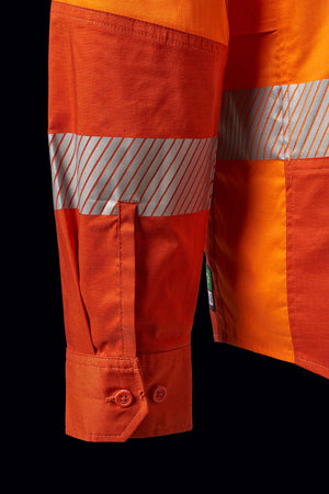 Close-up of the FXD LSH-2T Stretch Taped Hi Vis Long Sleeve Work Shirt, crafted from 145gsm stretch ripstop fabric with 50mm reflective tape. The image highlights the lower sleeve and half of the torso, showcasing a buttoned cuff on the sleeve and horizontal reflective stripes across both the sleeve and torso. The background is black.