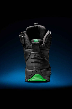 A close-up rear view of a single FXD WB-6 Work Boot in black and green, highlighting its sturdy tread, intricate stitching, and prominent branding on the heel, showcasing an advanced synthetic upper, set against a dark gradient background.
