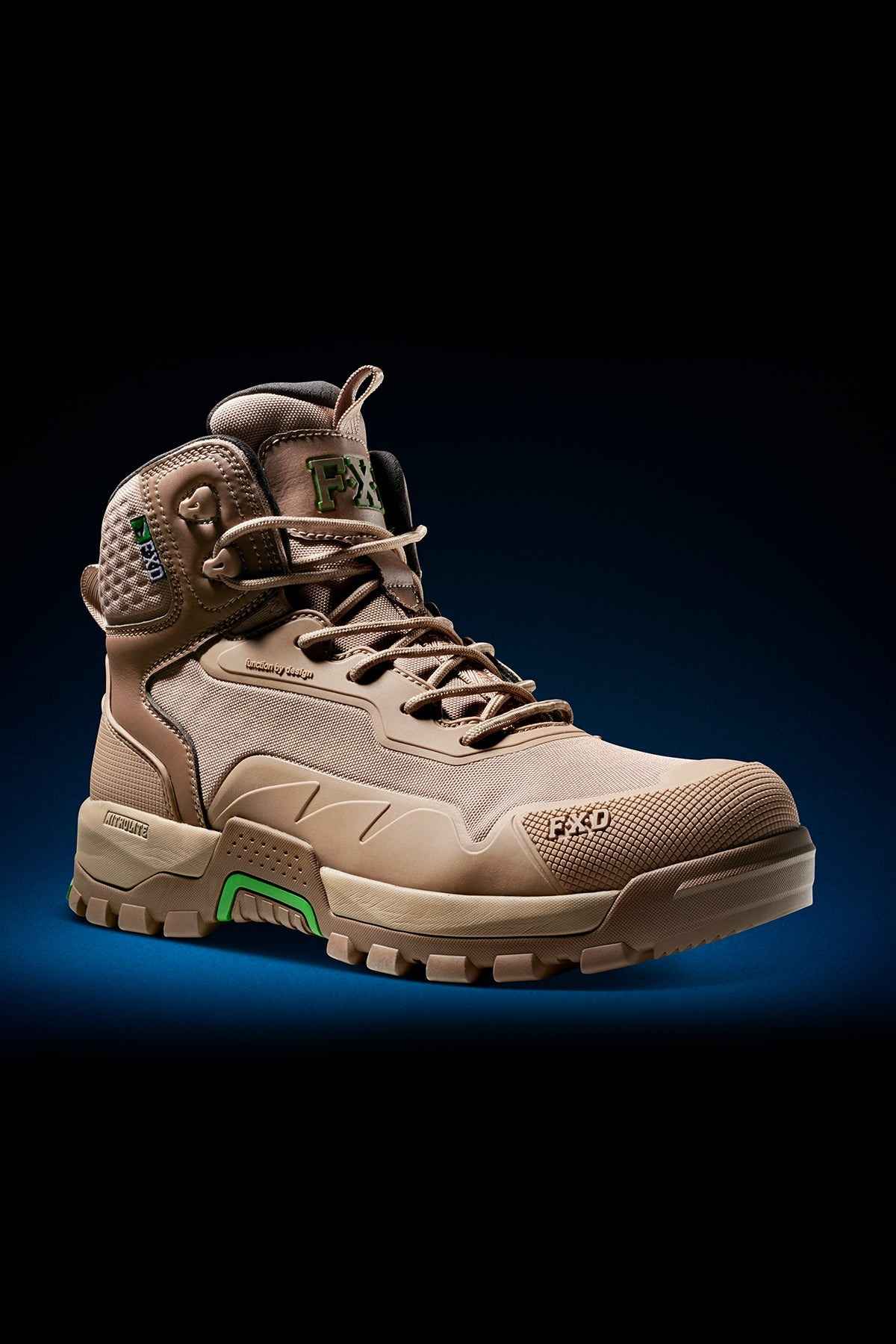 The FXD WB-6 Work Boot is a high-top, tan-colored hiking boot featuring a rugged, textured sole. It includes green accents and metal eyelets for lacing, along with branding on the tongue and side. A PORON heel insert ensures comfort. The detailed design of the boot is highlighted against a gradient of dark blue in the background.