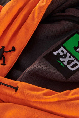 Close-up image of the FXD WF-1 Hoodie, an orange, windproof hoodie with black drawstrings. The inside features a black, textured lining and a label displaying "FXD" in white letters and "LARGE" in green letters.
