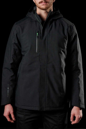 A man stands against a black background wearing the FXD WO-1 Insulated Work Jacket, featuring black wind and water resistant fabric and a zippered chest pocket. His face is partially visible with a mustache and beard, hands relaxed at his sides.