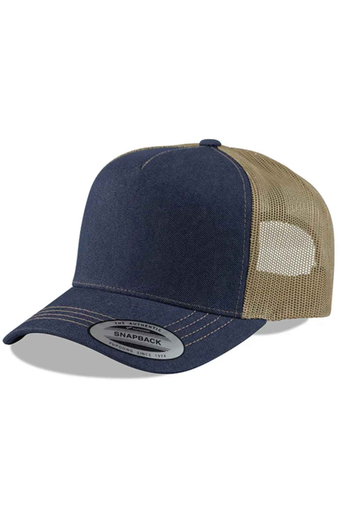 The FlexFit American Stitch Trucker Cap, in dark blue, boasts a curved brim and beige mesh back, enhanced by contrast stitching for added style. A silver sticker on the brim displays "Snapback," emphasizing its adjustable snapback strap for an ideal fit.