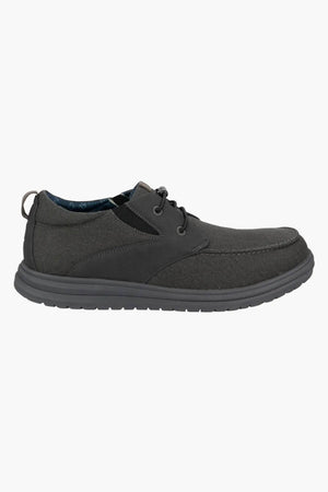 The Florsheim Brew City Canvas Lace Sneaker is a single dark gray casual lace-up shoe with a cushioned footbed, textured EVA sole, suede-like finish, and visible stitching, displayed in side profile on a white background.