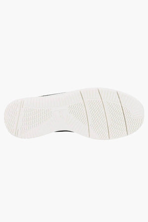 The image shows the white, textured sole of the Florsheim Conway Knit Moc Toe Slip On from below, set against a plain background. The sole displays multiple patterns designed to provide grip and flexibility.