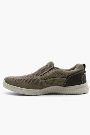 A side view of the Florsheim Conway Knit Moc Toe Slip On, featuring a brown mesh upper, black heel detail, beige lightweight EVA/rubber outsole, and memory foam insole, displayed against a white background.
