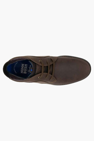 Top view of a brown leather casual shoe featuring laces, a textured leather upper, and the brand name on the cushioned footbed, similar to the Florsheim Otto Chukka Boot.