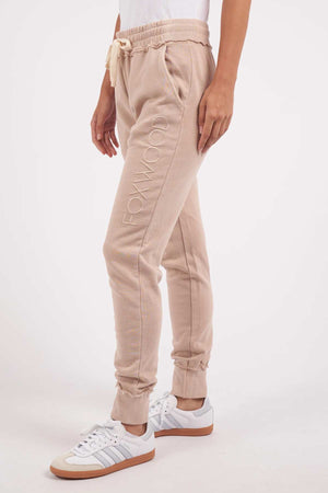 Foxwood Simplified Pant - Oatmeal. Side facing image of pants on model