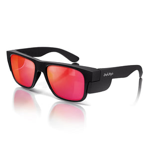 A pair of SafeStyle Fusions sunglasses with matte black frames and mirror red polarised lenses, angled slightly to the left. Featuring UV protection, the "SafeStyle" brand name is written in white on the temples. The reflection on the surface shows subtle hints of red and orange.