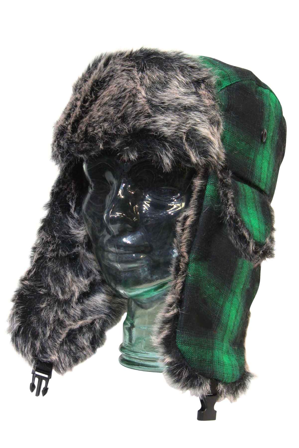 A transparent glass head model wears the GUM Arctic Trooper winter cap, featuring green plaid fabric, gray faux fur-lined ear flaps and brim, and secured with black plastic clips.