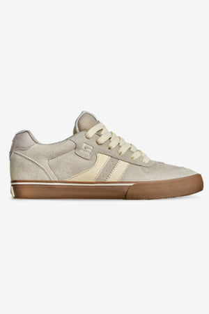 The Globe Encore-2 is a beige and cream low-top suede leather sneaker with a cushioned insole, cream laces, two cream side stripes, and a brown rubber sole, shown on a plain white background.