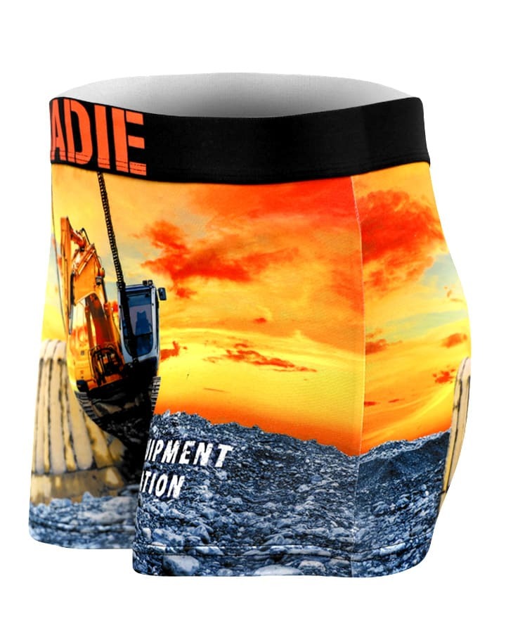 Tradie Mens Work N Surf Trunk features a vibrant excavator and sunset print, quick-drying fabric for comfort and durability, plus a black waistband with partial red text.