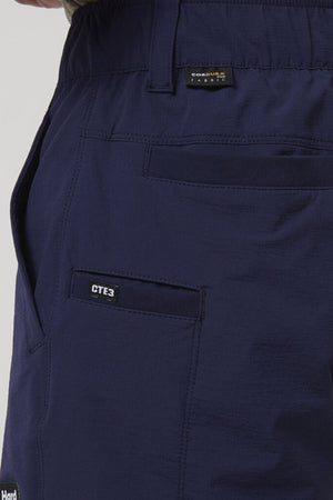 Close-up of the side and back pocket on dark blue Hard Yakka X Short Short, showing a "CORDURA FABRIC" label above the pocket and a "CTE3" label on the side. Made from durable Cordura Nylon with 4-way stretch for extra comfort.