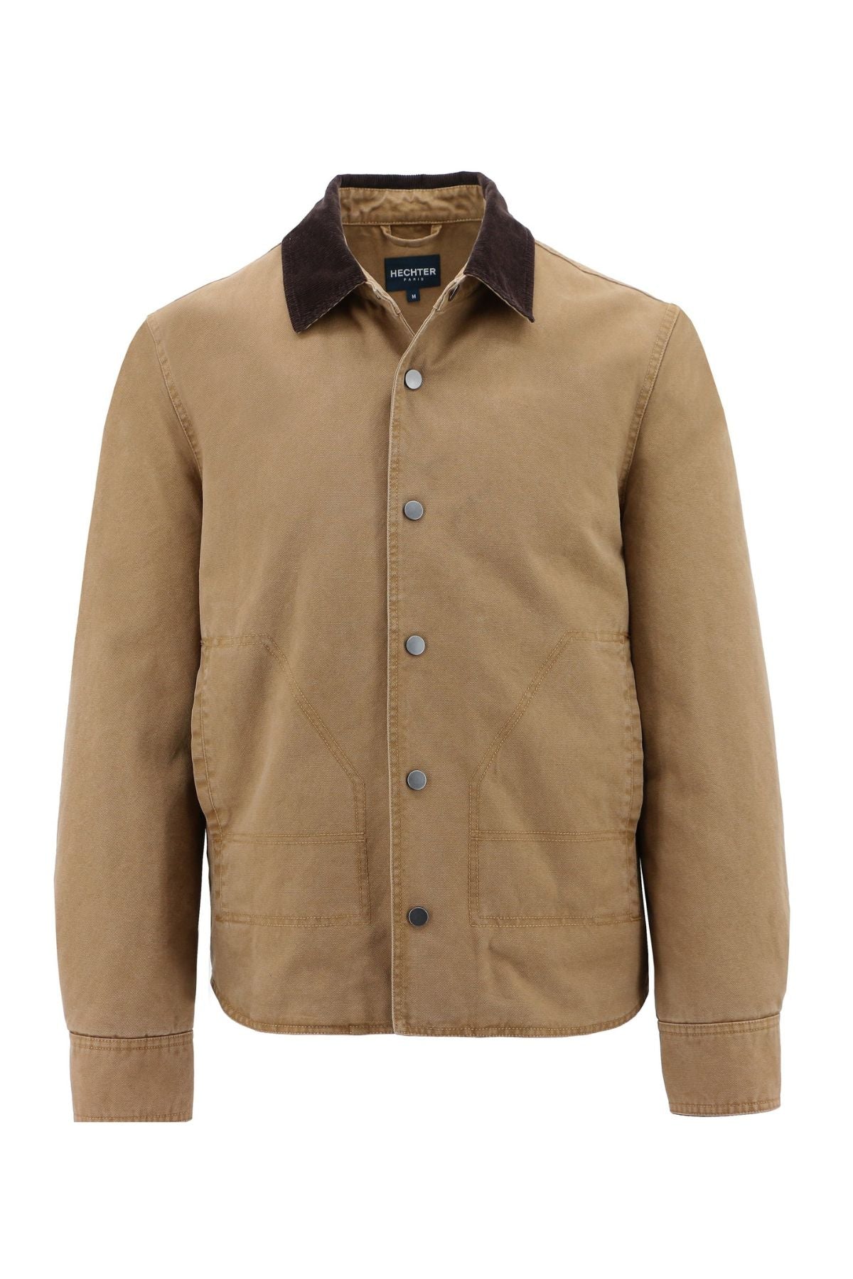 The Hechter Patrick Canvas Jacket is a tan snap-button jacket with a brown contrast collar, two large front pockets, visible stitching, and long sleeves. Made from 100% cotton for a structured yet casual look.