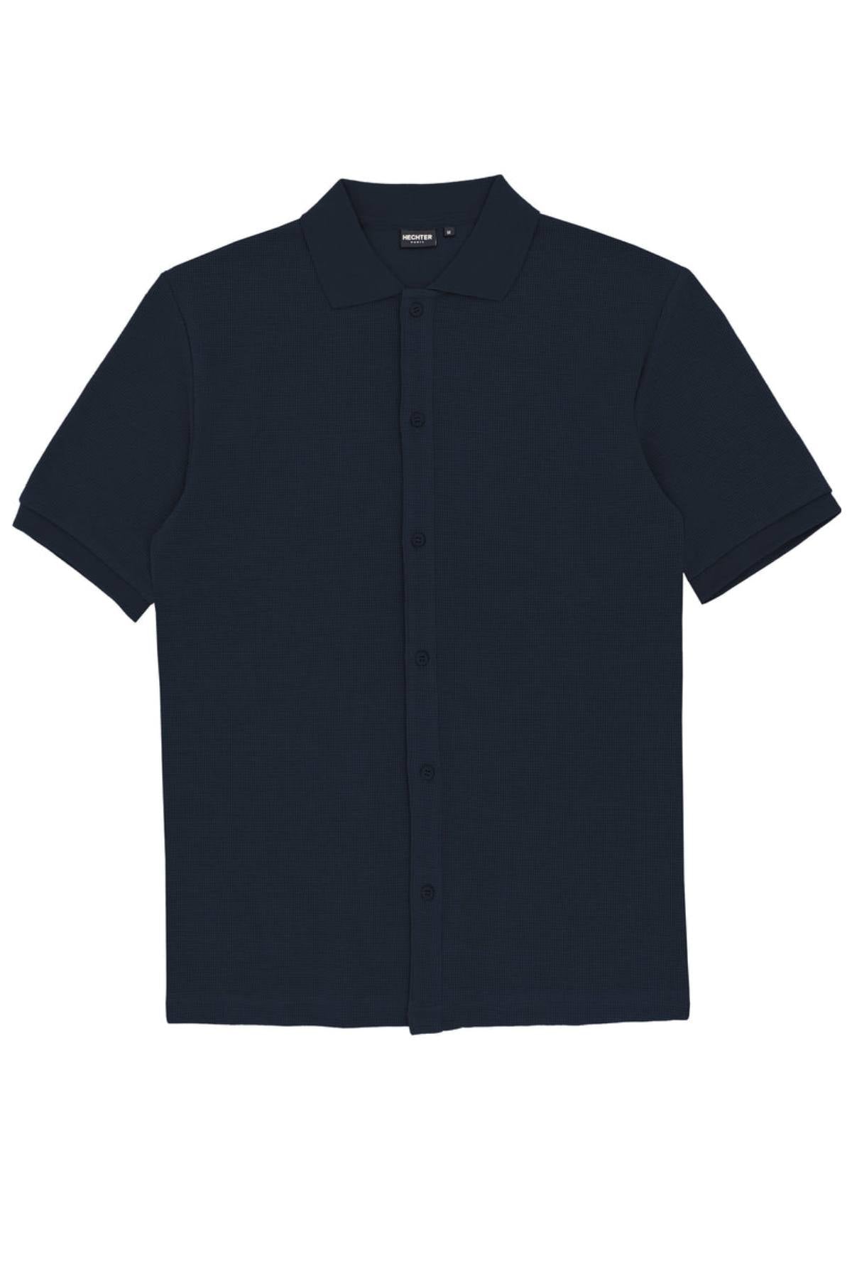 The Hechter Sheen Textured Cotton Blend Short Sleeve Shirt features a button-up front, collar, and dark navy blue textured fabric, shown laid flat on a white background.