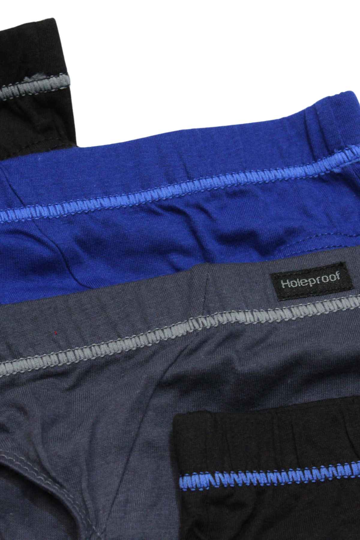 The Holeproof Tunnel Brief 4PK includes four pairs of men’s cotton briefs in black, blue, and gray with colored stitching and a visible "Holeproof" label for a durable fit.