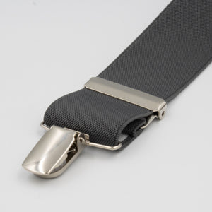 A close-up of Buckle Plain Braces in gray fabric, featuring adjustable straps with a shiny silver metal clip and adjustment piece, displayed on a plain white background.