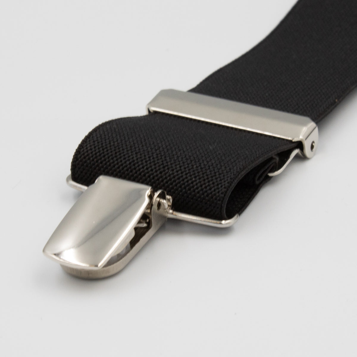 A close-up view of the black elastic strap from the Buckle Plain Braces, featuring a shiny silver high-quality clasp. This strap, often used as a component of adjustable braces or as a fastening mechanism, is displayed against a plain, neutral background.