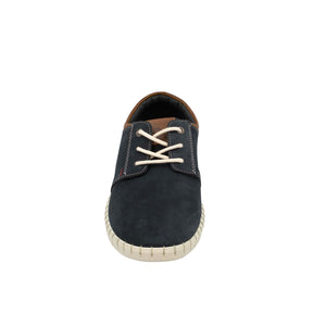 The Colorado Texan Shoe features a versatile sneaker design in a dark tone with white laces and a beige sole. Made from nubuck leather, it has brown ankle detailing, visible stitching, and a memory foam footbed for comfort, all showcased against a plain white background.