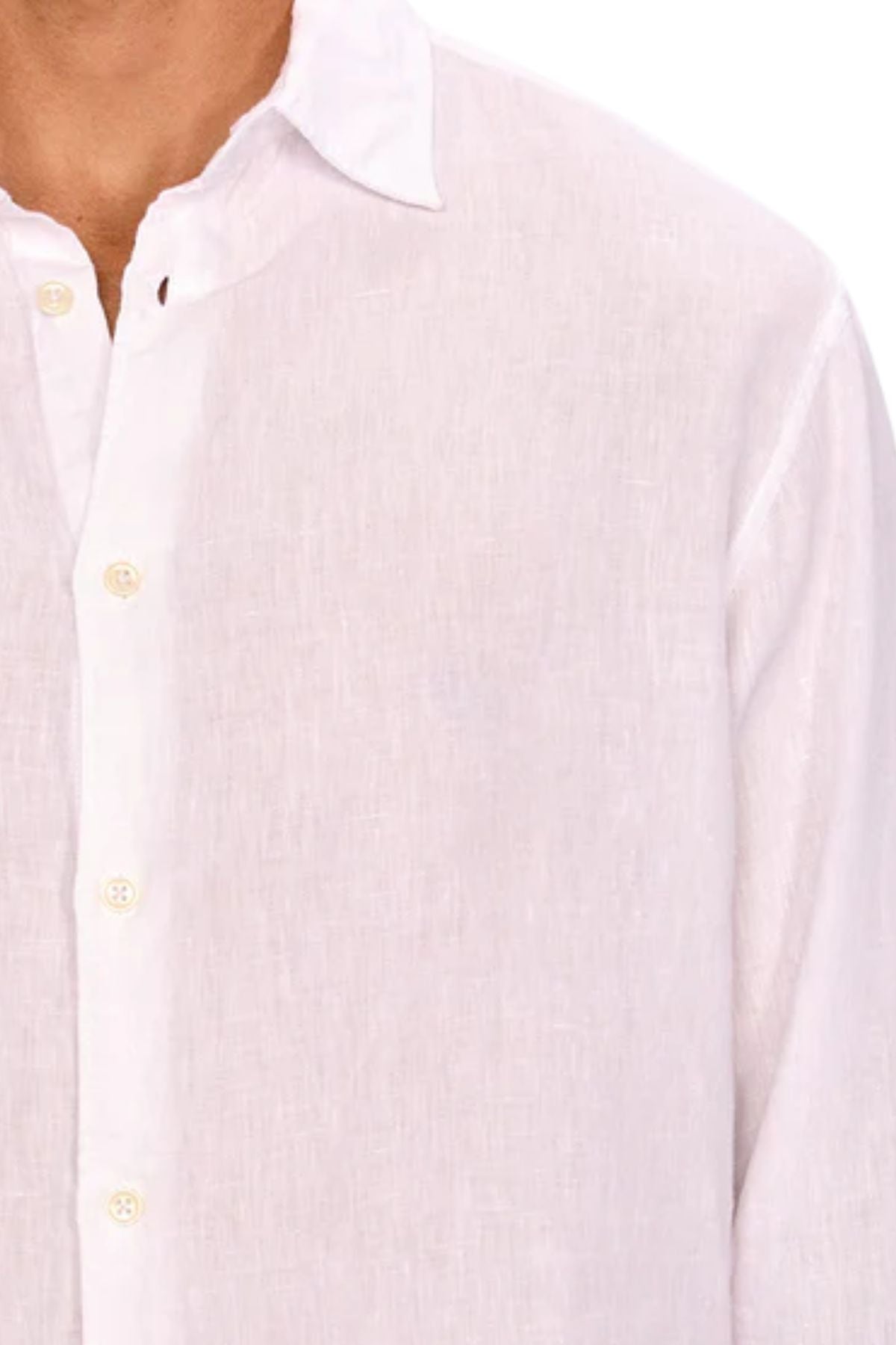 A close-up shows a person wearing the Industrie The St Martins Shirt, a light-colored, regular fit linen shirt with long sleeves, collar, and cream buttons. Made from breathable, lightweight, semi-sheer fabric. Only the upper torso is visible.