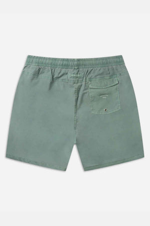 A green pair of Industrie The Bahama Angler Shorts for men is displayed with the backside facing forward. The shorts feature an elastic waistband and a single pocket on the right side, adorned with a small button closure. The lightweight fabric makes them perfect for a beach day.