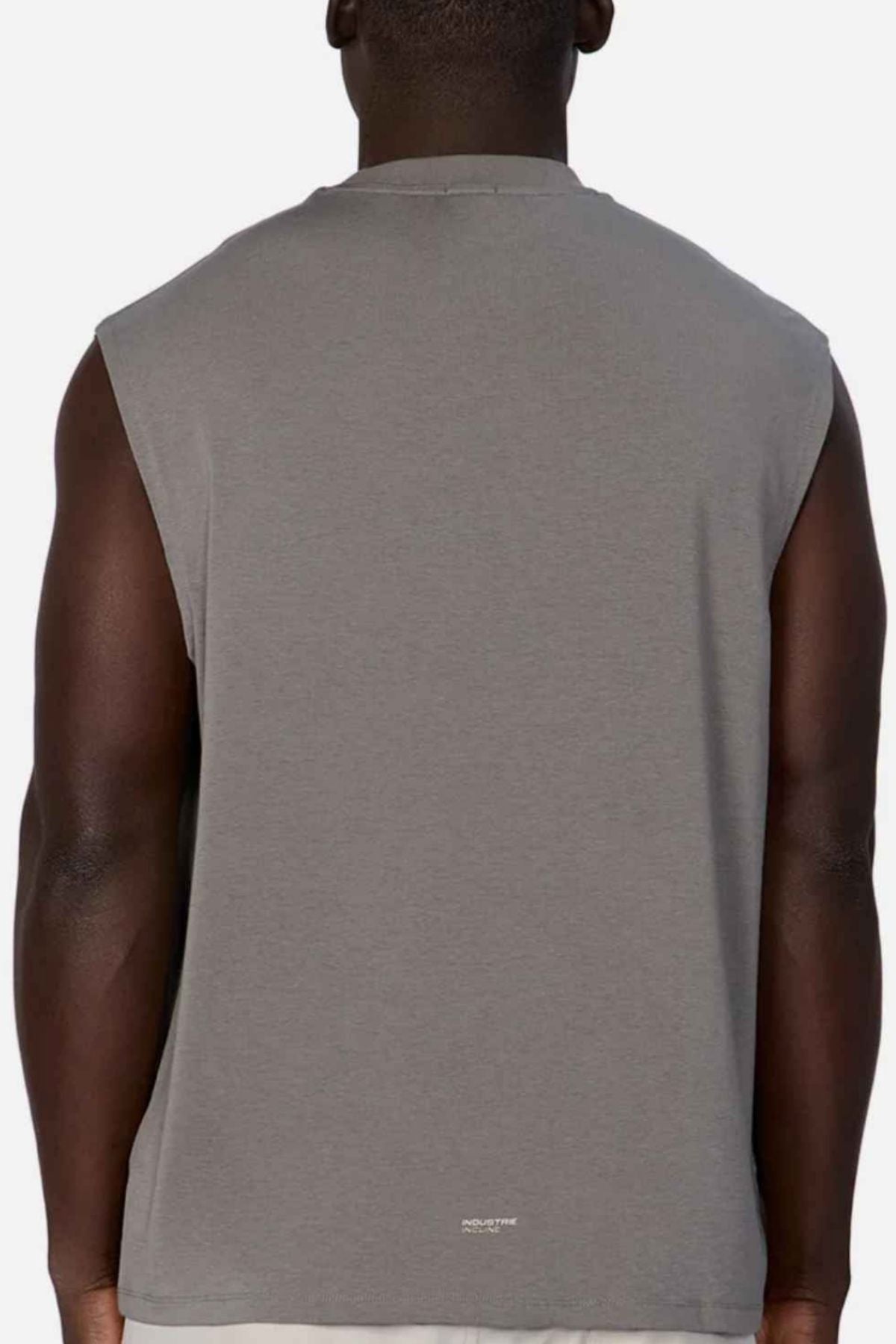 A person is seen from behind wearing the Industrie The Freeman Sleeveless Tee in gray, featuring quick-dry fabric, against a plain light background.
